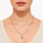 Female model wearing 316L stainless steel heart zircon birthstone necklace to showcase fit for established brands