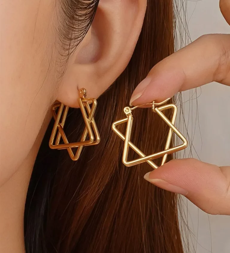 Female model wearing 316L stainless steel intertwined star hoop earrings for small brands