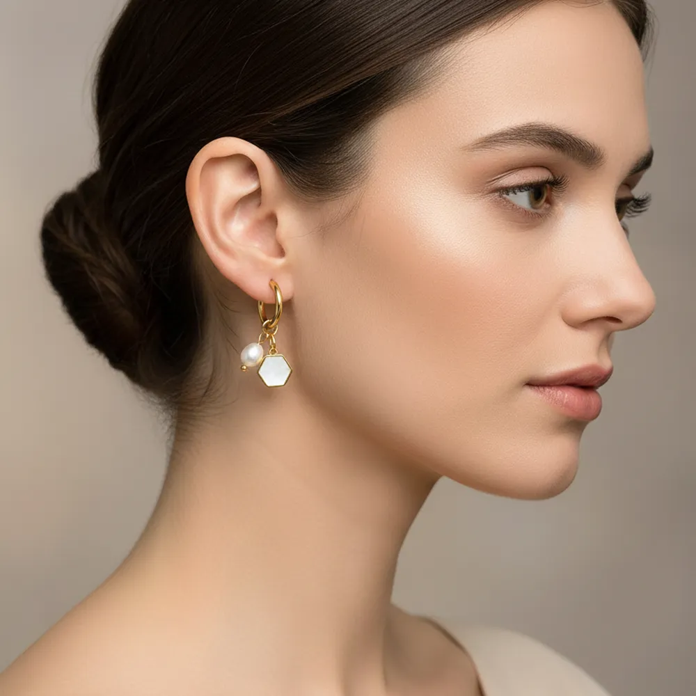 Female model wearing stainless steel shell imitation pearl hoop earrings to showcase fit for small businesses