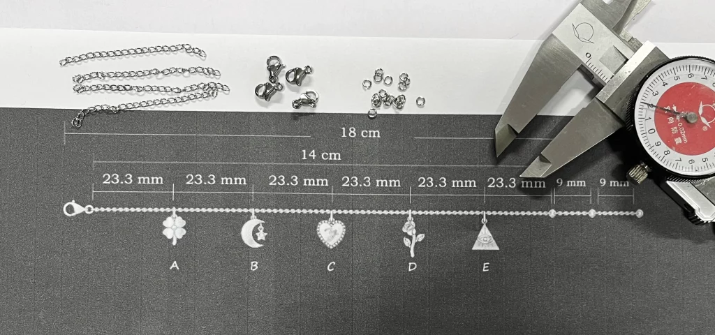 DFM audit of a 316L stainless steel charm bracelet showing chain length, charm spacing, and pendant layout before production.
