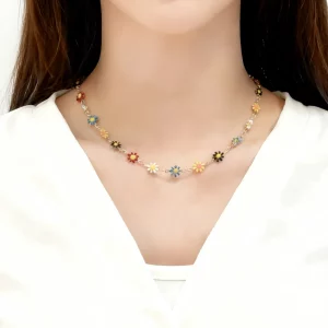 Female model wearing daisy flower necklace stainless steel from direct factory