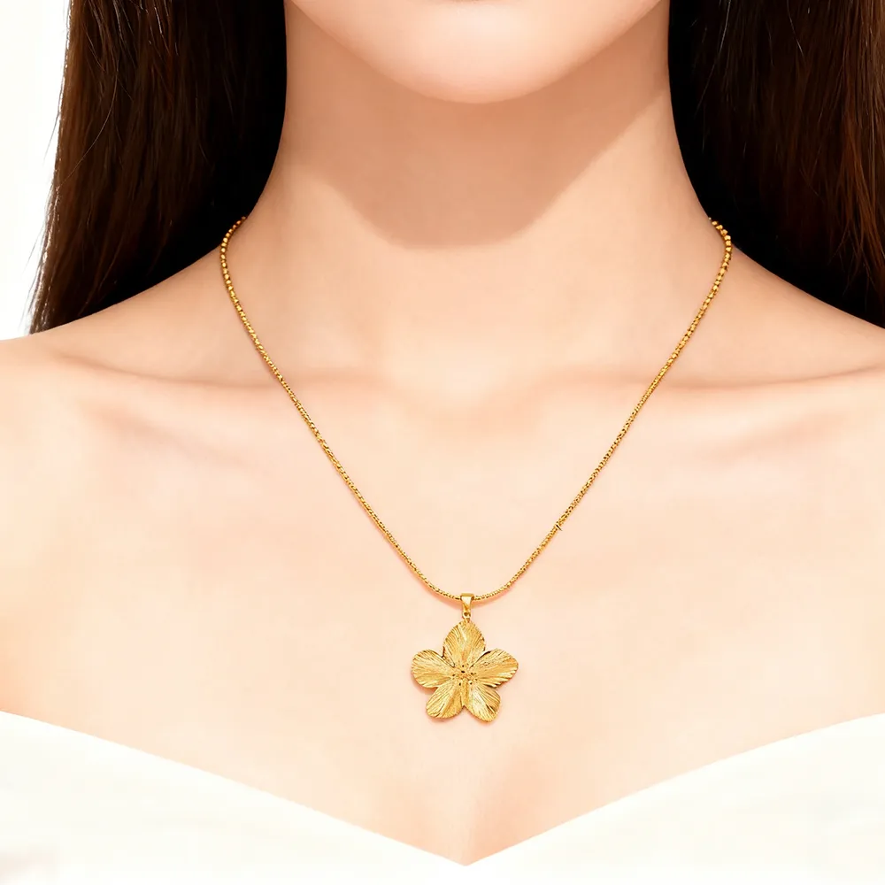 Female model wearing stainless steel 18k gold plated flower pendant necklace for fashion brand
