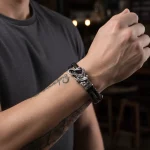 Male model wearing 316L stainless steel Random Highly organic forms style leather bracelet for Shopify Store Owner