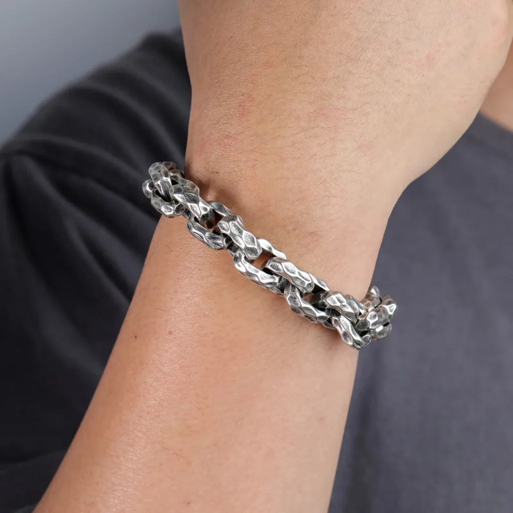 Male model wearing 361L stainless steel Hand-hammered textures style bracelet for Jewelry Studio