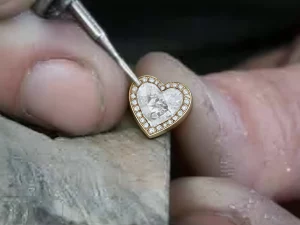 setting cubic zirconias in a heart charm bracelet