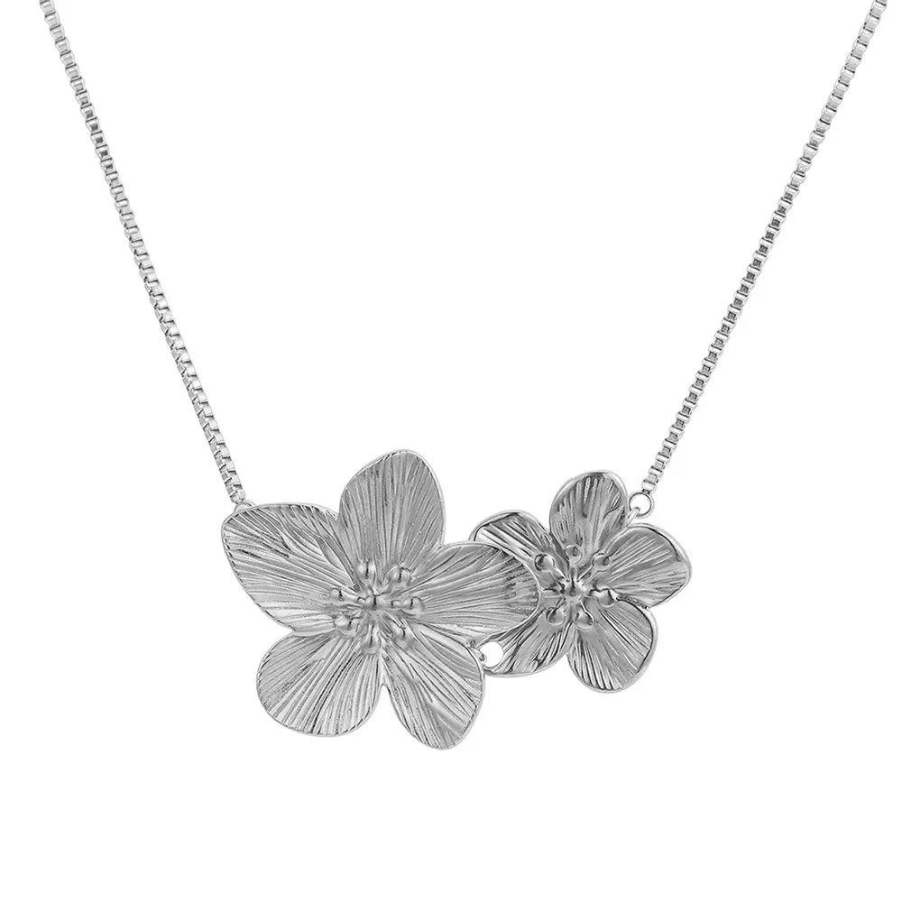female model wearing stainless steel flower pendant necklace from fashion jewelry vendors