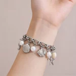 Female model wearing 316L Stainless Steel Silver Ocean Theme Imitation Pearl Bracelet to showcase fit for E-commerce Stores