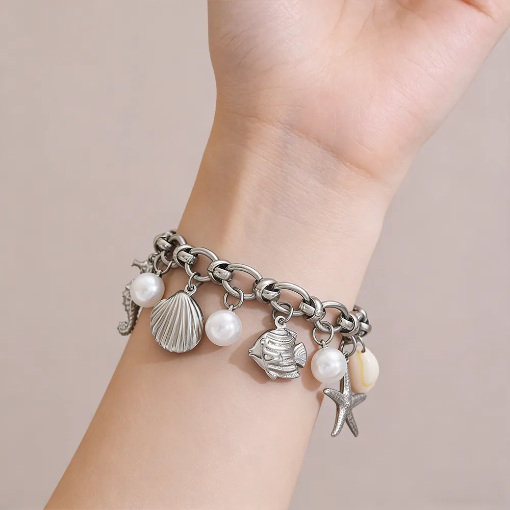 Female model wearing 316L Stainless Steel Silver Ocean Theme Imitation Pearl Bracelet to showcase fit for E-commerce Stores