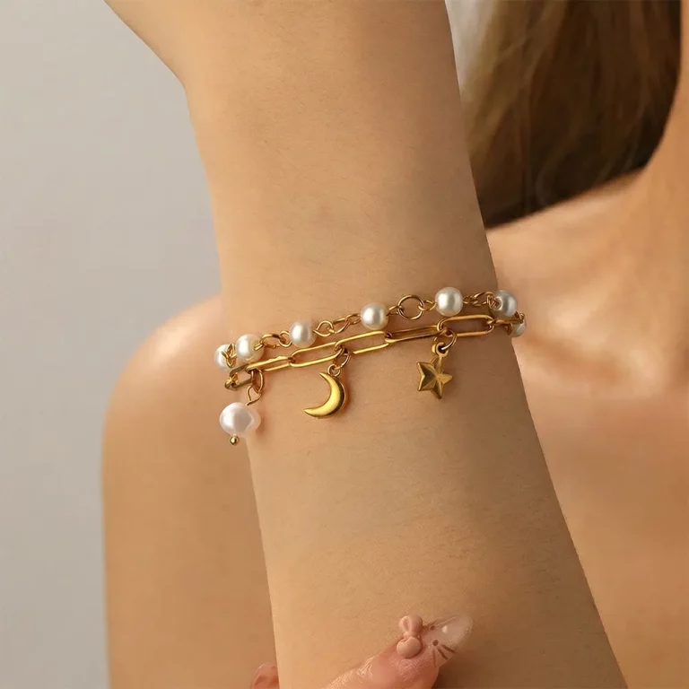 Female model wearing stainless steel multi layer imitation pearl bracelet to showcase fit for major retailers