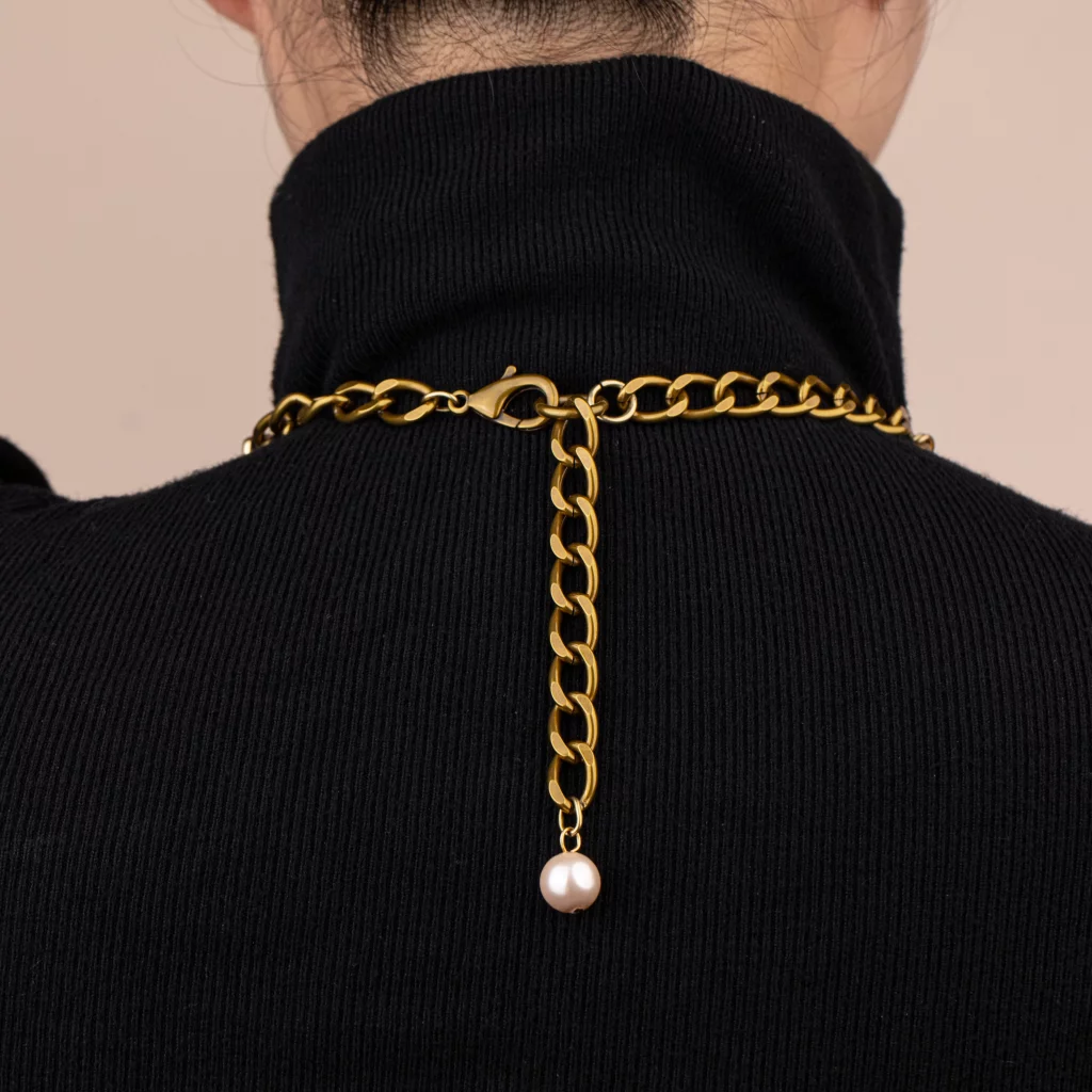 Female model wearing vintage gold chain necklace clasp back view pearl drop