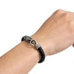 Male Model Wearing Stainless Steel Viking Dragon Braided Leather Bracelet for Wholesale Buyers