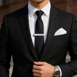 Male model wearing 316L Stainless Steel Text Logo Tie Clip to showcase fit for Established Brands