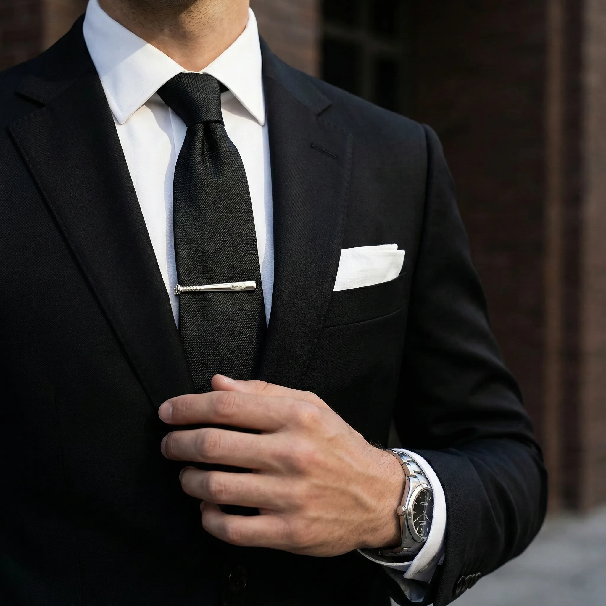 Male model wearing Brass Baseball Sports Tie Clip to showcase fit for fashion brands