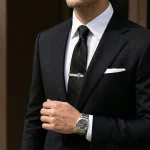 Male model wearing Medical Caduceus tie clip to showcase fit for boutique brands