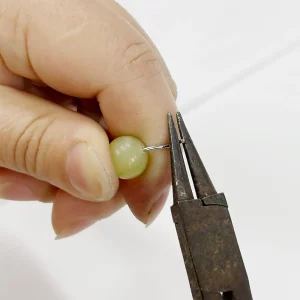 Process of bending stainless steel eye pin for colorful bead wallet chain supplier