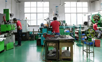 Interior of a medium-sized jewelry factory in China showing CNC machining and a professional production line for established brands.