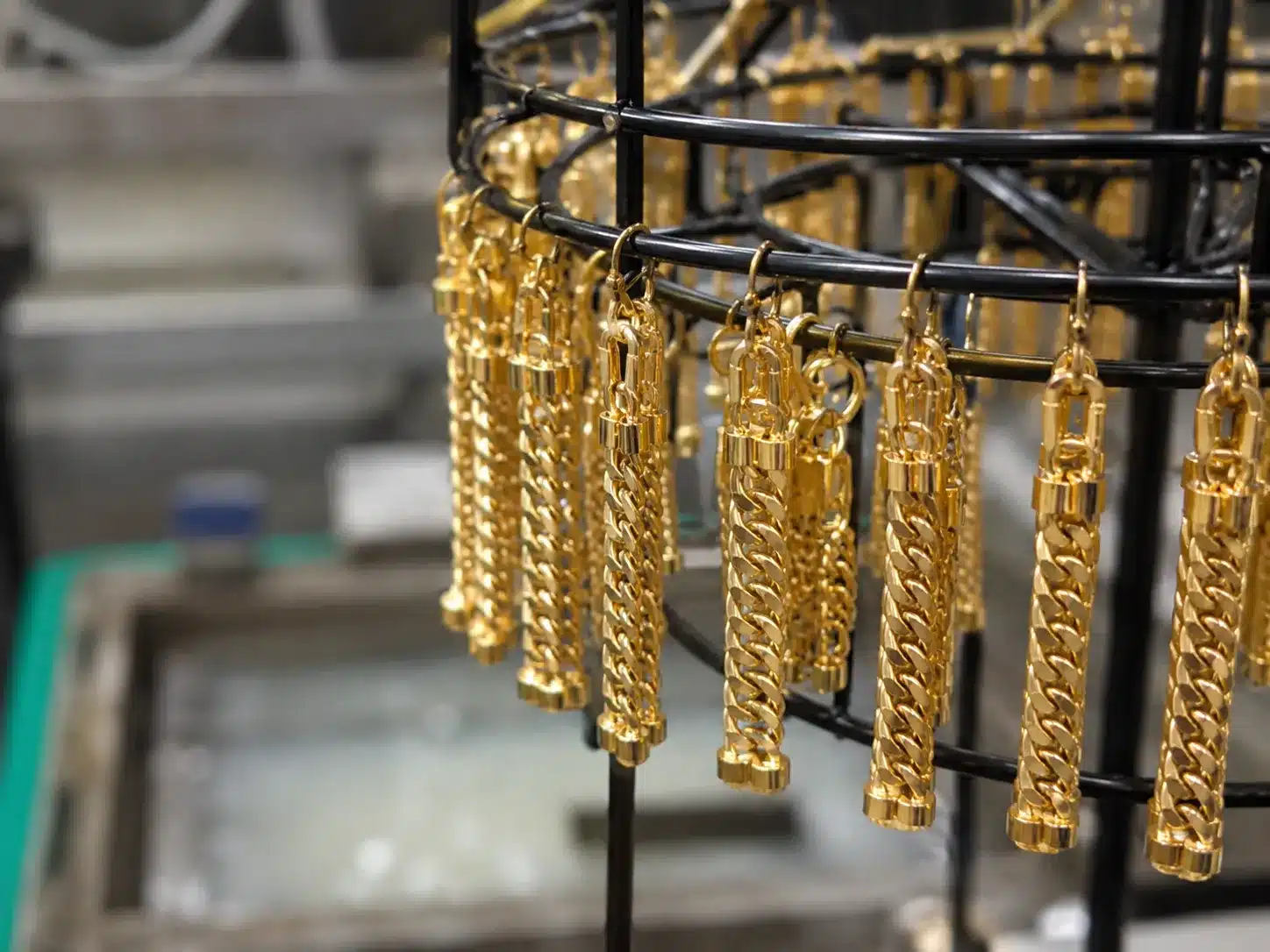 PVD plating, polishing, engraving, sandblasting, and stone setting affect pricing.