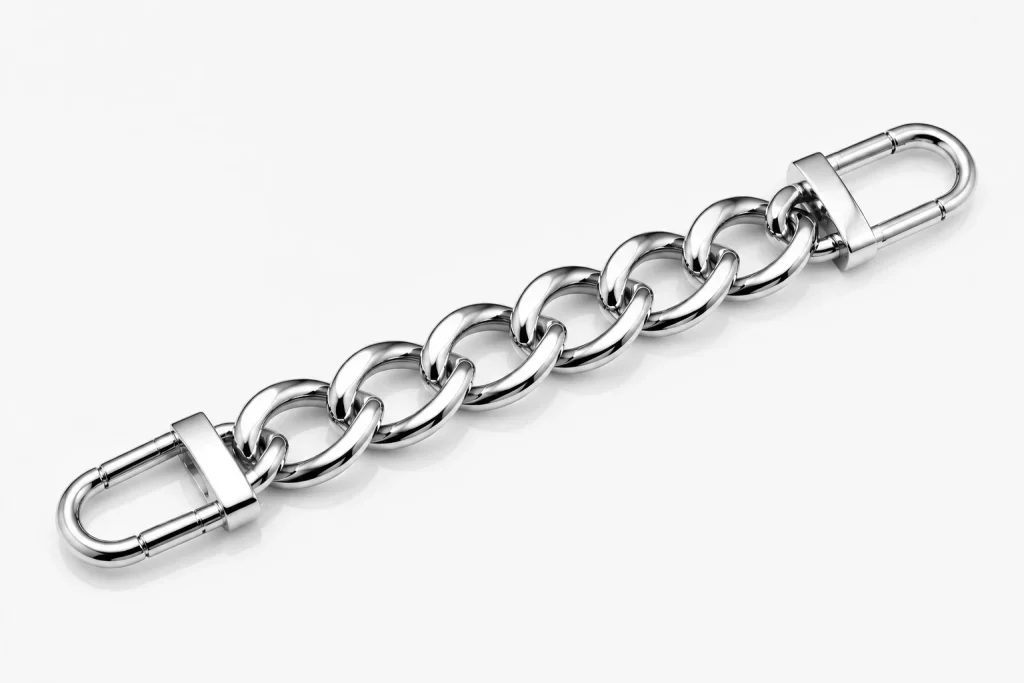 Polished metal bag chain with smooth, reflective surface, meeting B2B high-end accessory supply standards and enhancing visual appeal.