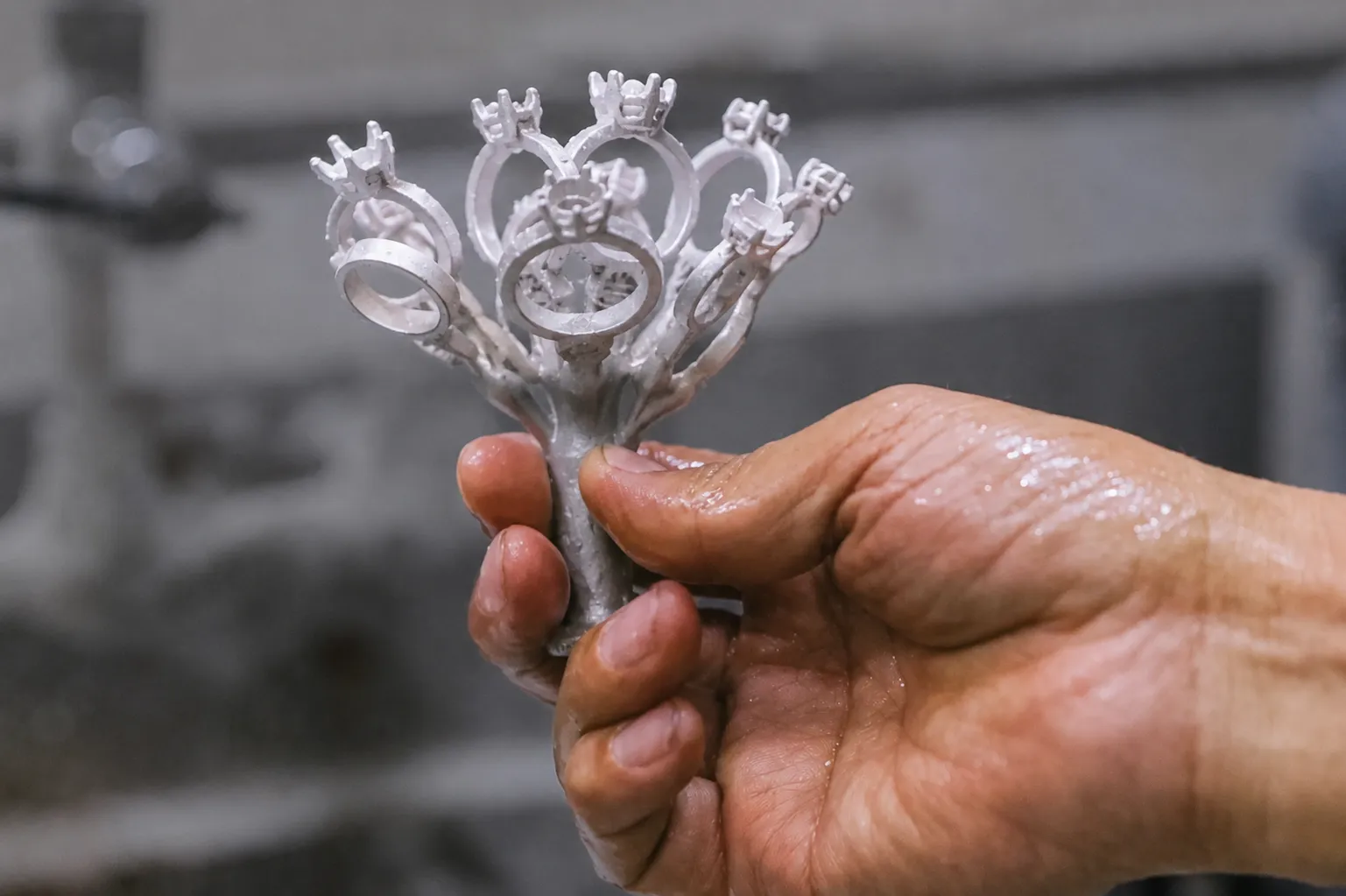 Metal tree cleaned after high-pressure water jet rinsing during the lost wax casting process for jewelry manufacturing.