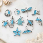 Custom ocean-themed blue enamel charms by a jewelry manufacturer for OEM and personalized bracelet and necklace designs