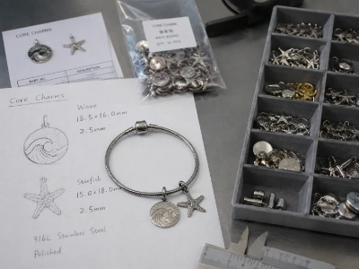 Core charm development with technical drawings and bracelet samples for custom OEM charm bracelet manufacturing and private label jewelry brands