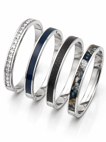 Custom stainless steel bangles with CZ stones, enamel, leather and decorative stone inlays for OEM and ODM jewelry manufacturing