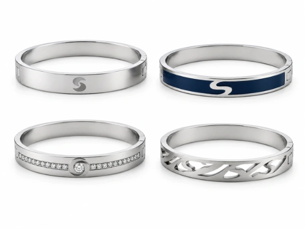 Custom stainless steel bangles with logo engraving, enamel inlay, stone setting and cut-out details for OEM jewelry manufacturing