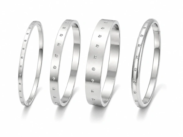 Custom stainless steel bangle bracelets in multiple widths and profiles for private label and OEM jewelry production