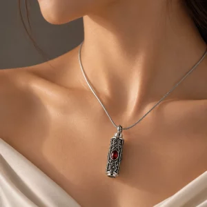 Custom stainless steel locket necklace with an antique silver cylinder pendant and red gemstone, OEM and ODM manufacturer for jewelry brands