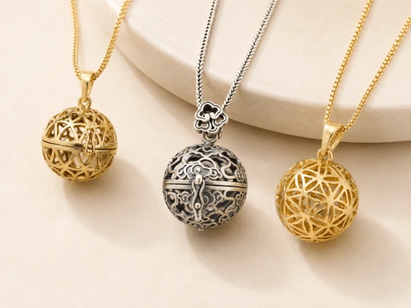 sphere-stainless-steel-locket-necklace-oem-manufacturer Custom sphere stainless steel locket necklace collection with gold and antique silver openwork designs for OEM and ODM jewelry manufacturing