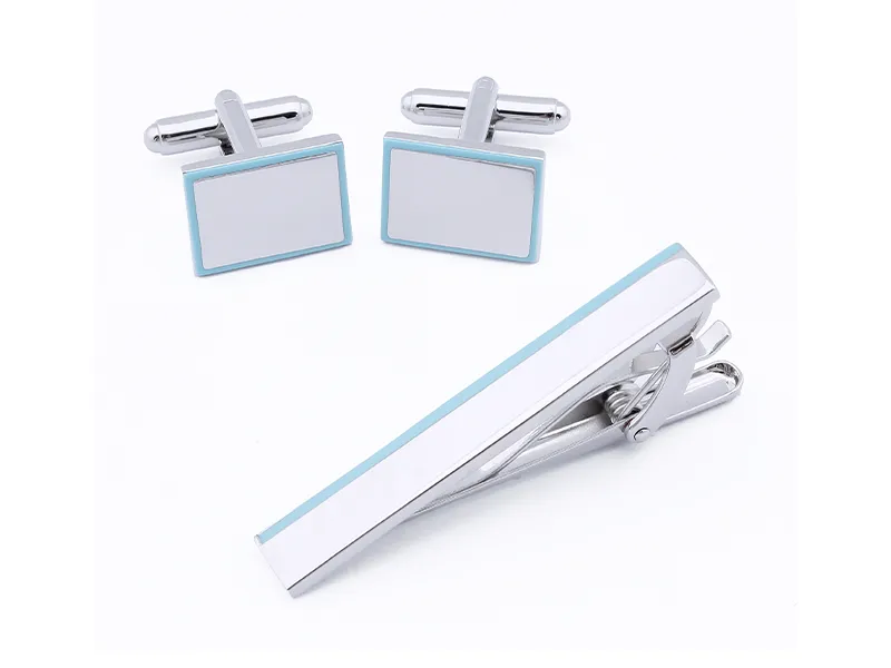 Minimalist cufflink and tie clip set with clean lines and modern understated style