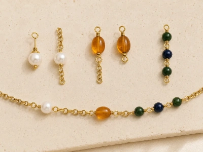 Brass necklace connection samples showing pearl caps, resin bead eye pins and individually linked colored beads