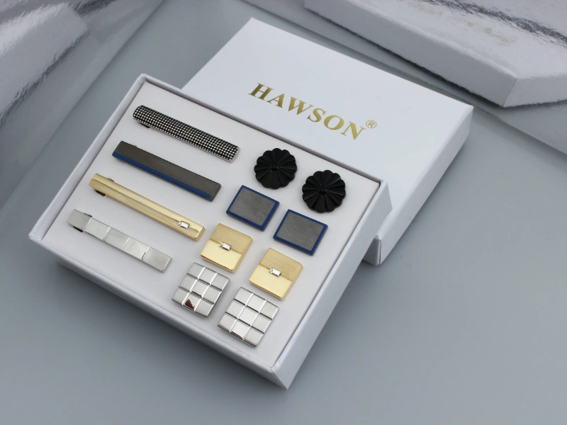 Custom cufflinks and tie clips with consolidated styles, finishes and order quantities to reduce tooling costs and lower unit prices.