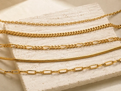 Custom brass necklace chain styles including cable, curb, Figaro, snake and geometric link chains