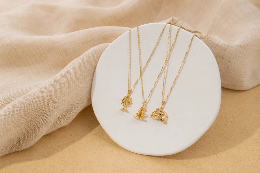 Custom brass necklace collection featuring delicate gold chains and decorative pendant designs