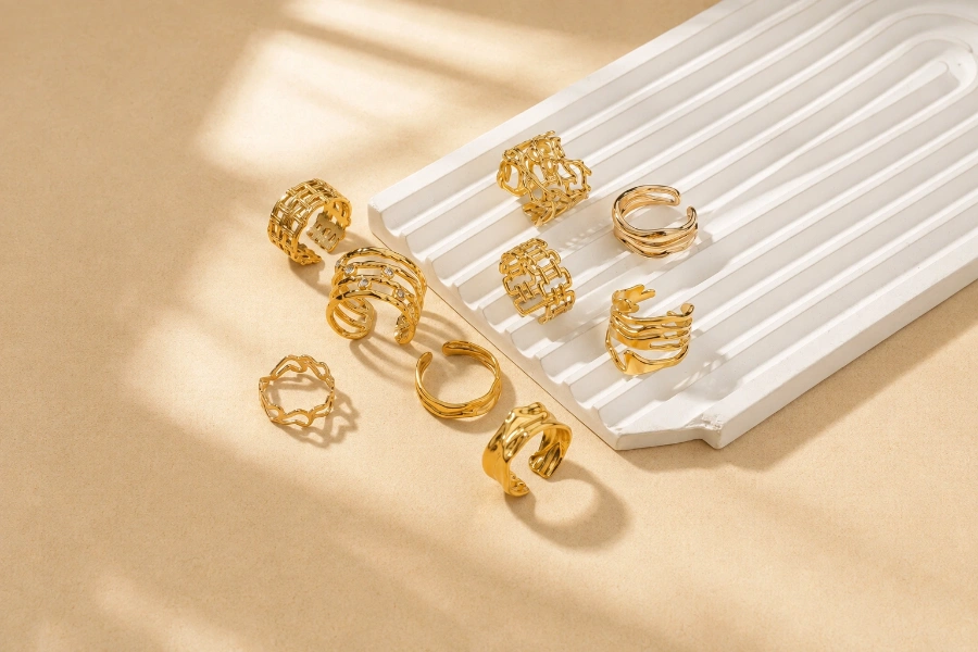 Custom brass ring collection featuring openwork, geometric, and sculptural gold-tone designs