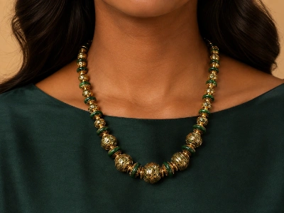 Model wearing a custom green enamel brass beaded necklace produced by an OEM brass necklace manufacturer