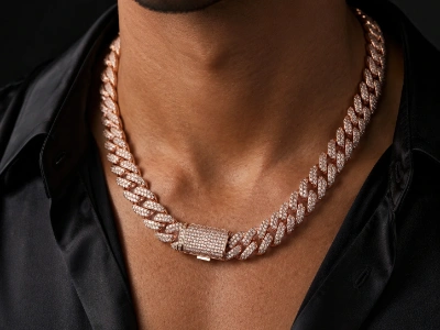 Male model wearing a custom rose gold brass Cuban chain necklace made by an OEM brass necklace manufacturer