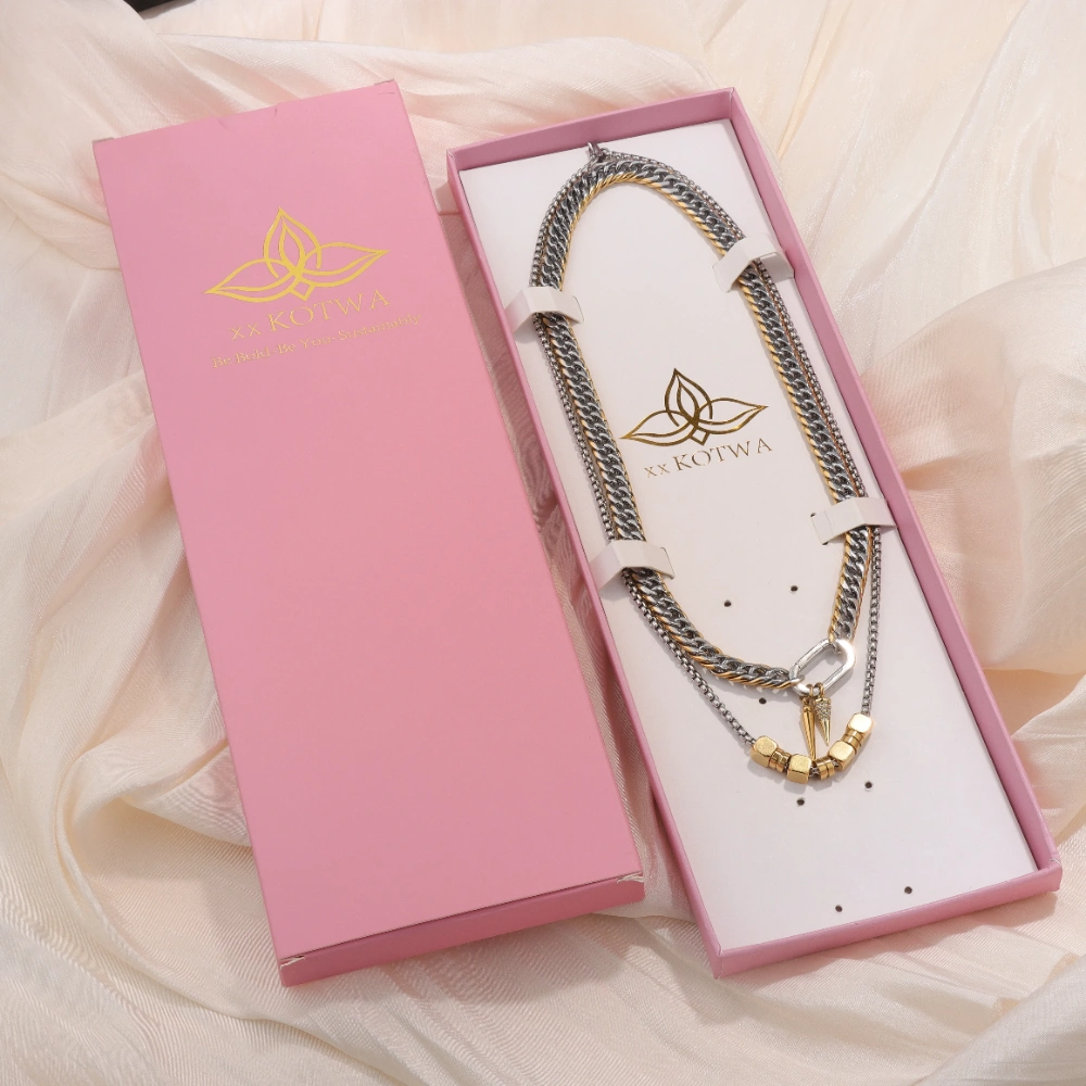 Custom jewelry packaging with a necklace secured in a branded pink presentation box, showing logo artwork, fitted inserts, and final product positioning for packout approval.
