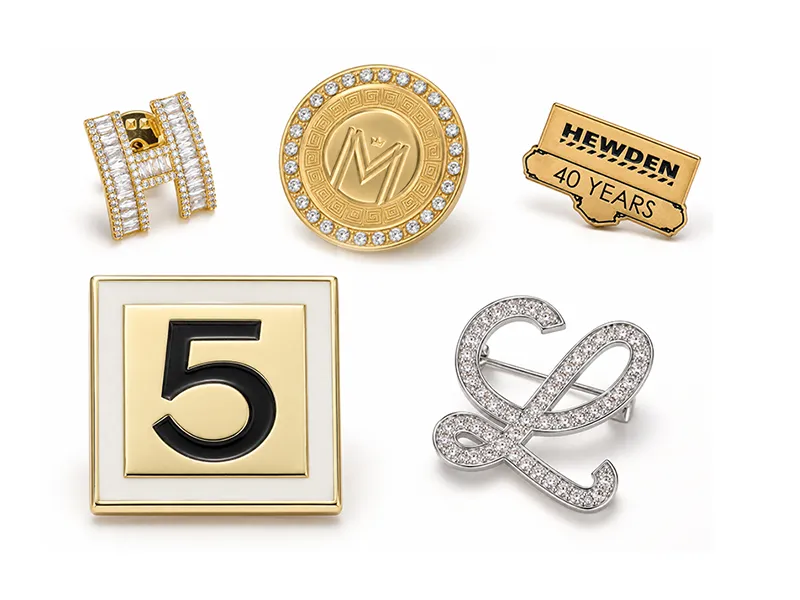 Custom logo brooch designs with initials, numbers, text and engraved details for OEM/ODM fashion jewelry manufacturing.