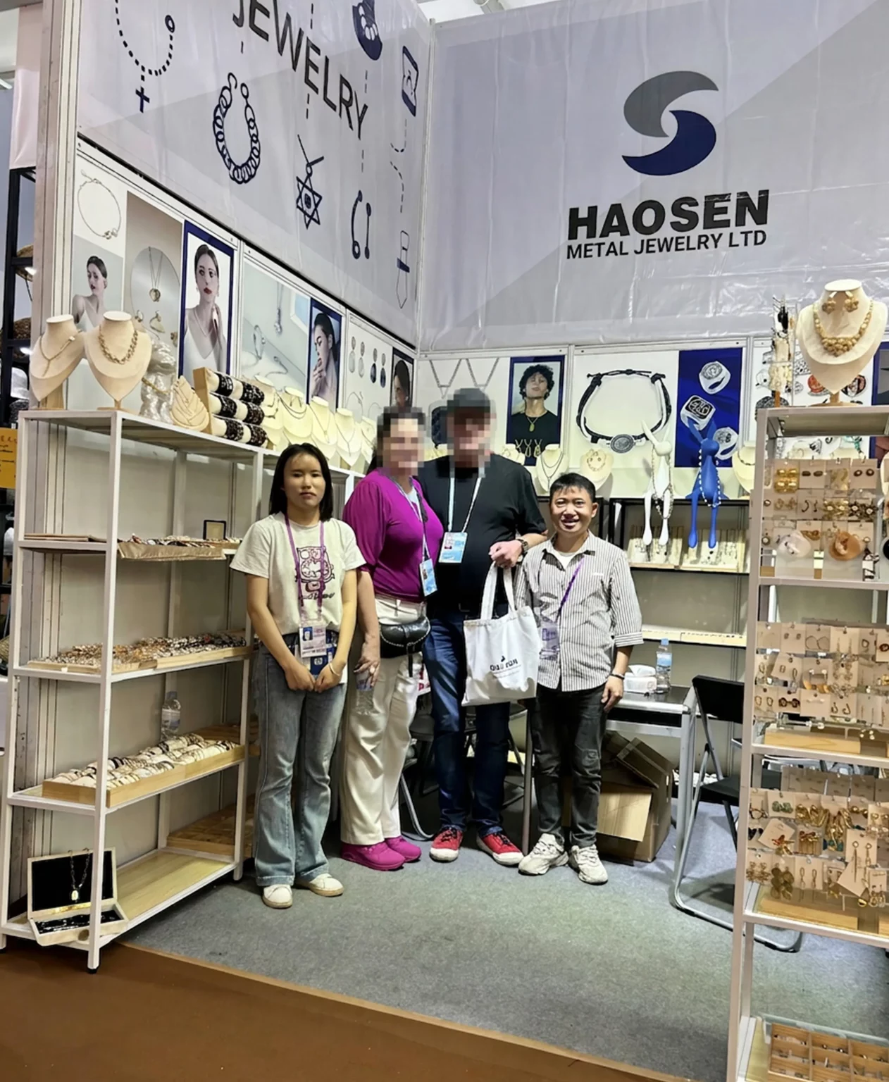 Haosen Jewelry team with buyers at a Canton Fair fashion jewelry exhibition booth