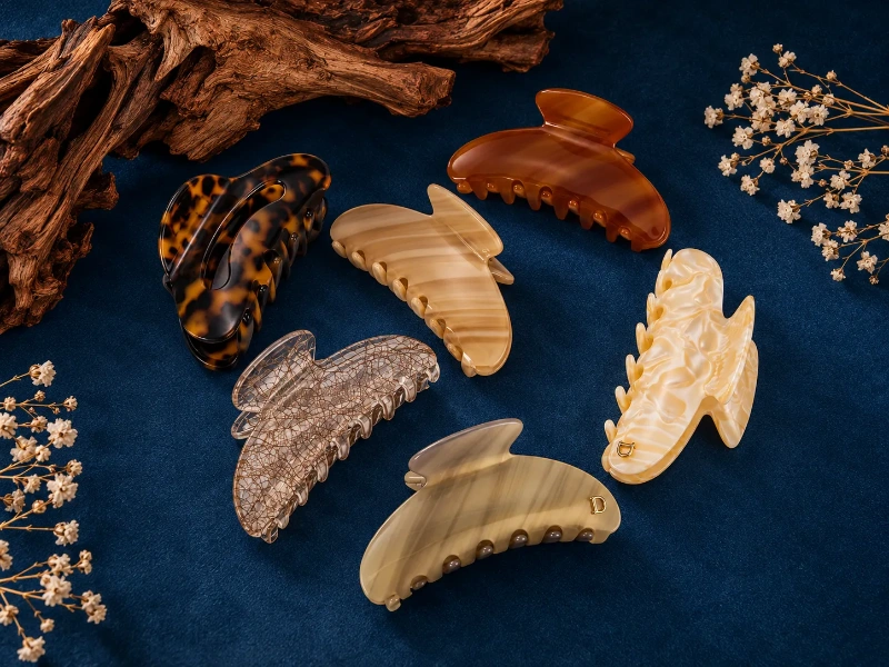 Resin hair claw clips in varied colors and patterns showing lightweight custom hair accessory options.