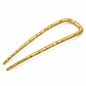 18K gold-plated U-shaped two-prong hair fork with a hammered texture and rounded tips on a clean white background.