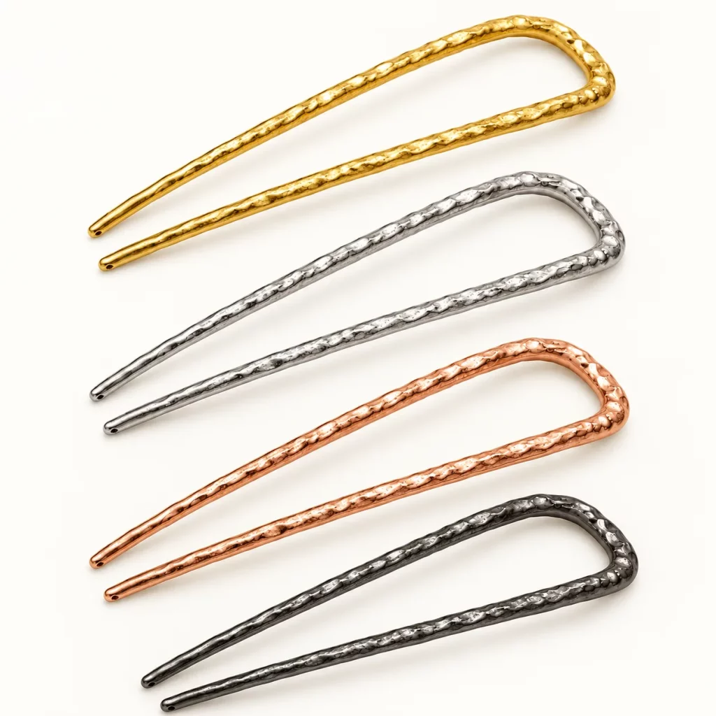 Hammered U-shaped two-prong hair forks shown in gold, silver, rose gold, and dark gunmetal-tone finishes for custom plating selection.