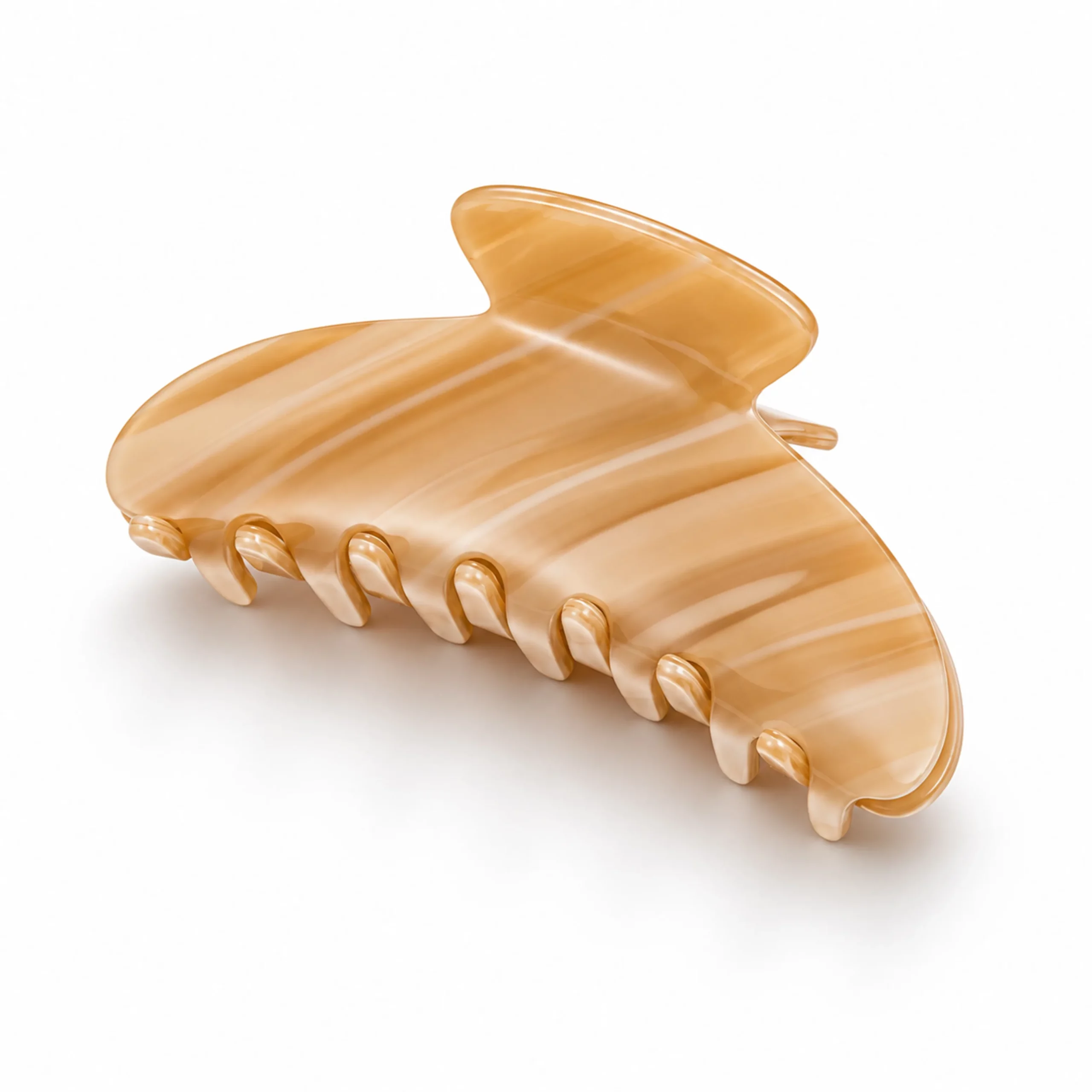 Honey striped cellulose acetate hair claw clip with a curved body and smooth polished surface.