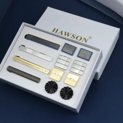Custom jewelry packaging displaying tie clips and cufflinks in a branded presentation box with a fitted insert for a coordinated accessory collection.