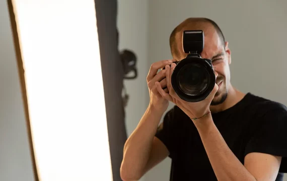 male-product-photographer-doing-his-job-studio